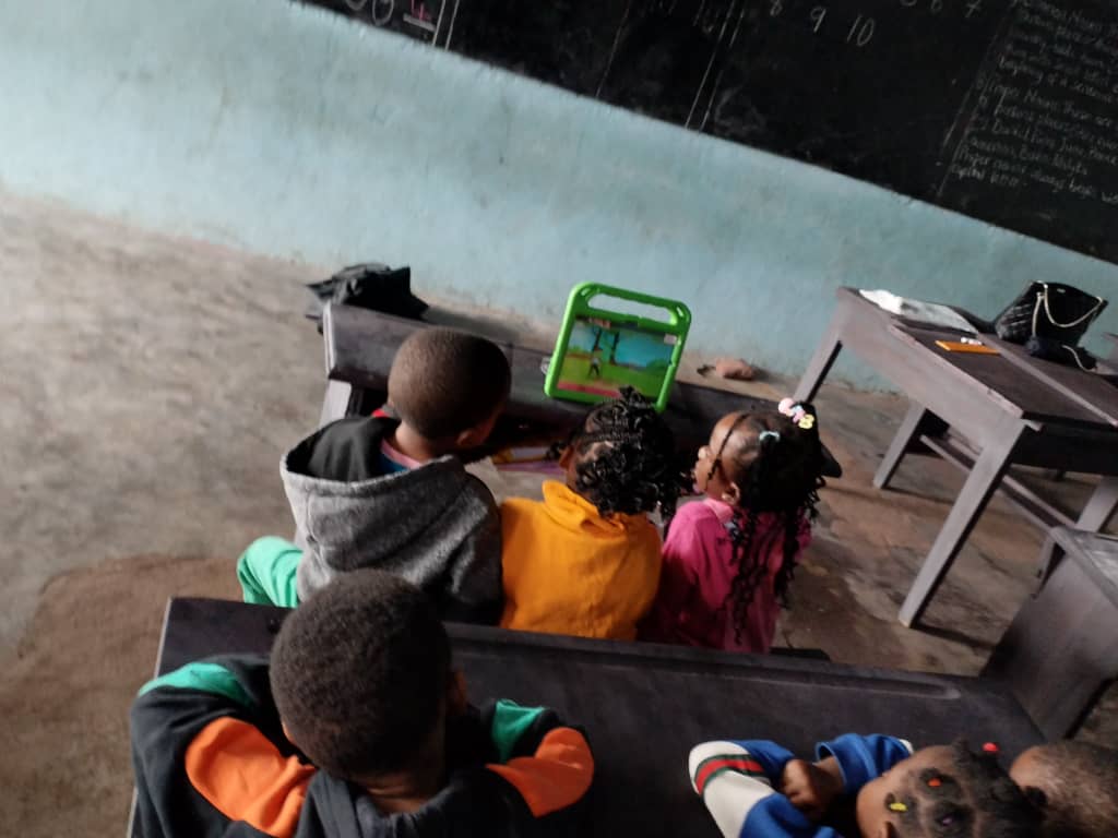 a group of children sitting in a classroom