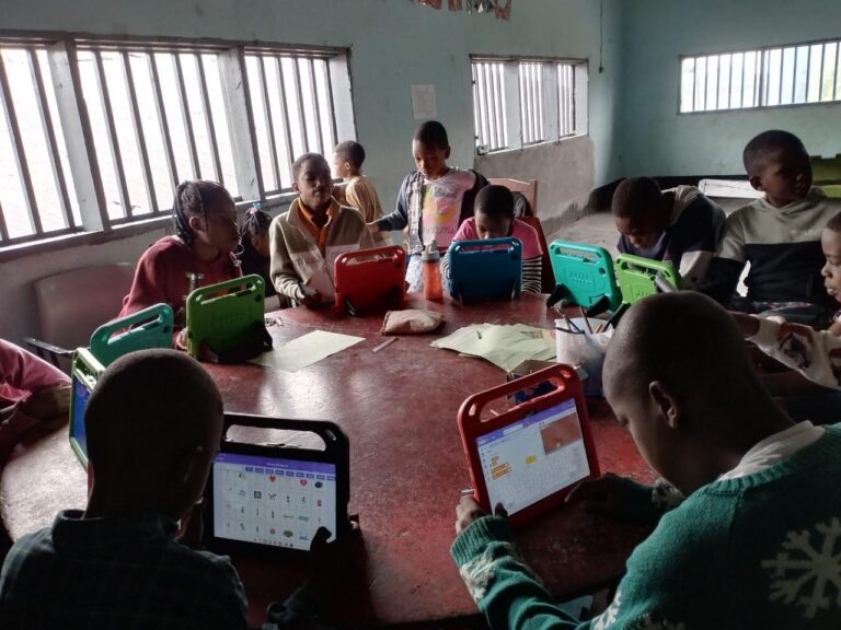 Bridging the Digital Divide: How PMS Buea & DELC Foundation Are Revolutionizing Learning With (1 & 0's) young African learning digital skills